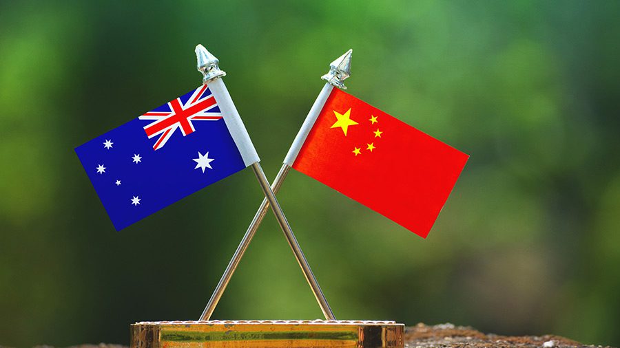 The Australian and the Chinese flags side by side on a table